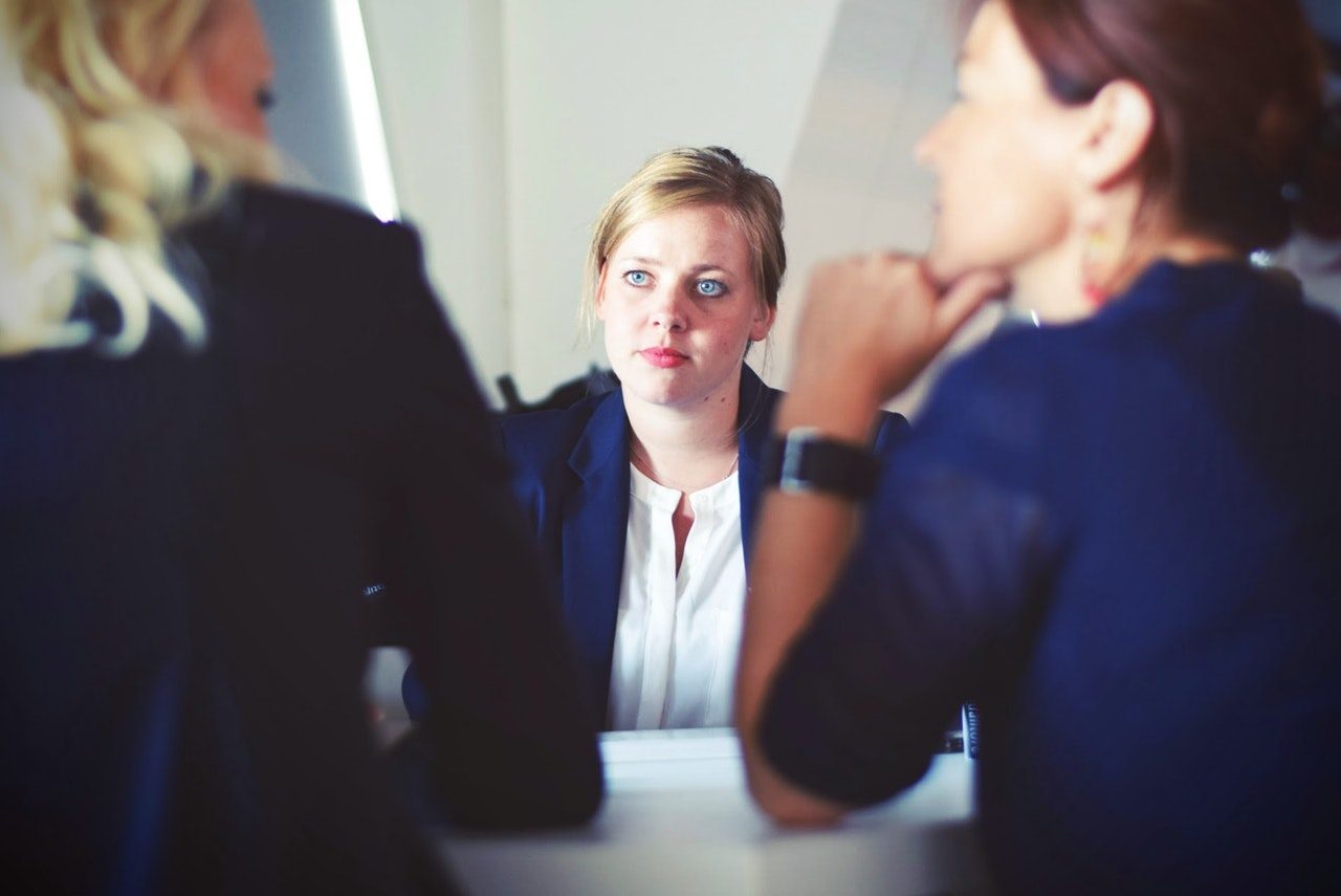 A businesswoman advising a colleague